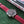 DAEM Nassau black dial red perforated strap watch