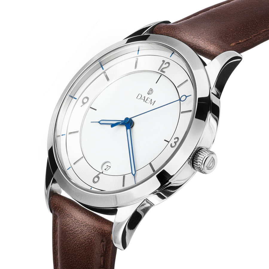 DAEM royal white dial watch with blue hands brown leather side
